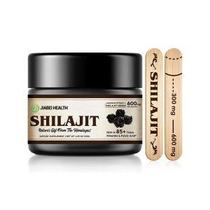 A black jar of JiaBei Health Shilajit Resin, labeled "Maximum Potency - 600mg Shilajit Resin per serving," and "Rich in 85+ Trace Minerals & Fulvic Acid." Two wooden applicators showing 300mg and 600mg measurements are beside it. This premium Himalayan Shilajit is offered by a GMP, ISO22000, HALAL, and KOSHER certified bulk provider, with a minimum order quantity of 500 units for wholesale and private label opportunities.