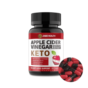 A black bottle of JiaBei Health Apple Cider Vinegar Keto capsules, with red and black capsules spilled out beside it. The label indicates "WEIGHT LOSS SUPPORT" and "90 Capsules," with "Garcinia Cambogia," "Metabolism Boost," "Cleanse & Detox," and "Promote Ketosis" listed as key benefits.