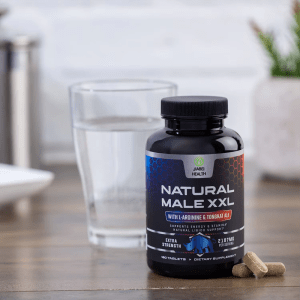 A bottle of JiaBei Health Natural Male XXL Tablets next to a glass of water and a few tablets, set in a daily use environment, supporting energy, stamina, and libido.