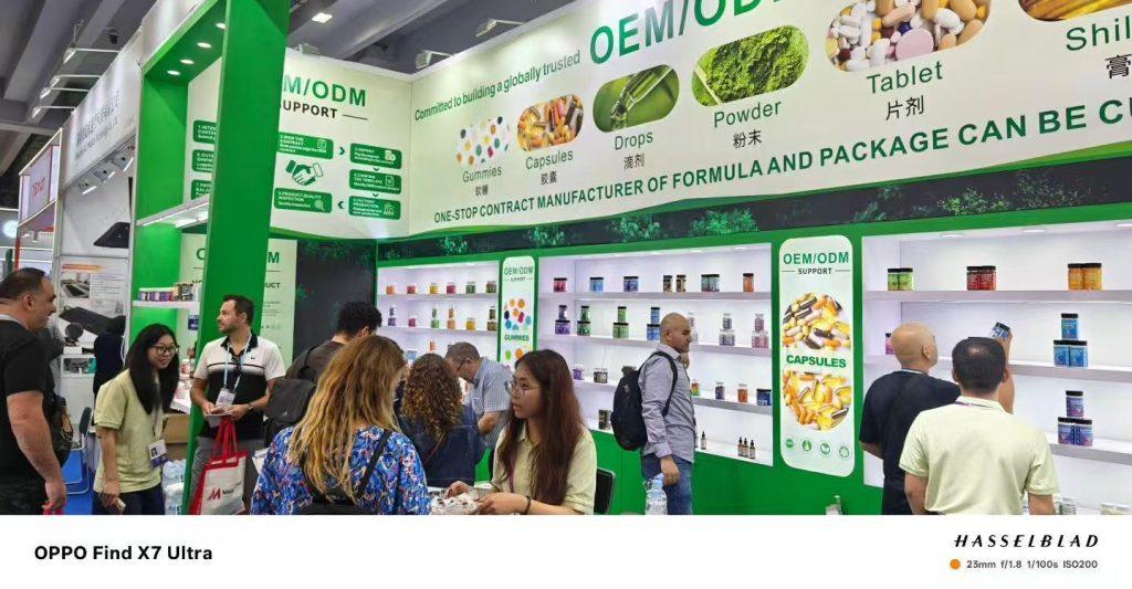 Jiabei Health OEM supplement manufacturer booth at Canton Fair 2025 in Guangzhou, showcasing gummies, capsules, powders, and drops to global buyers