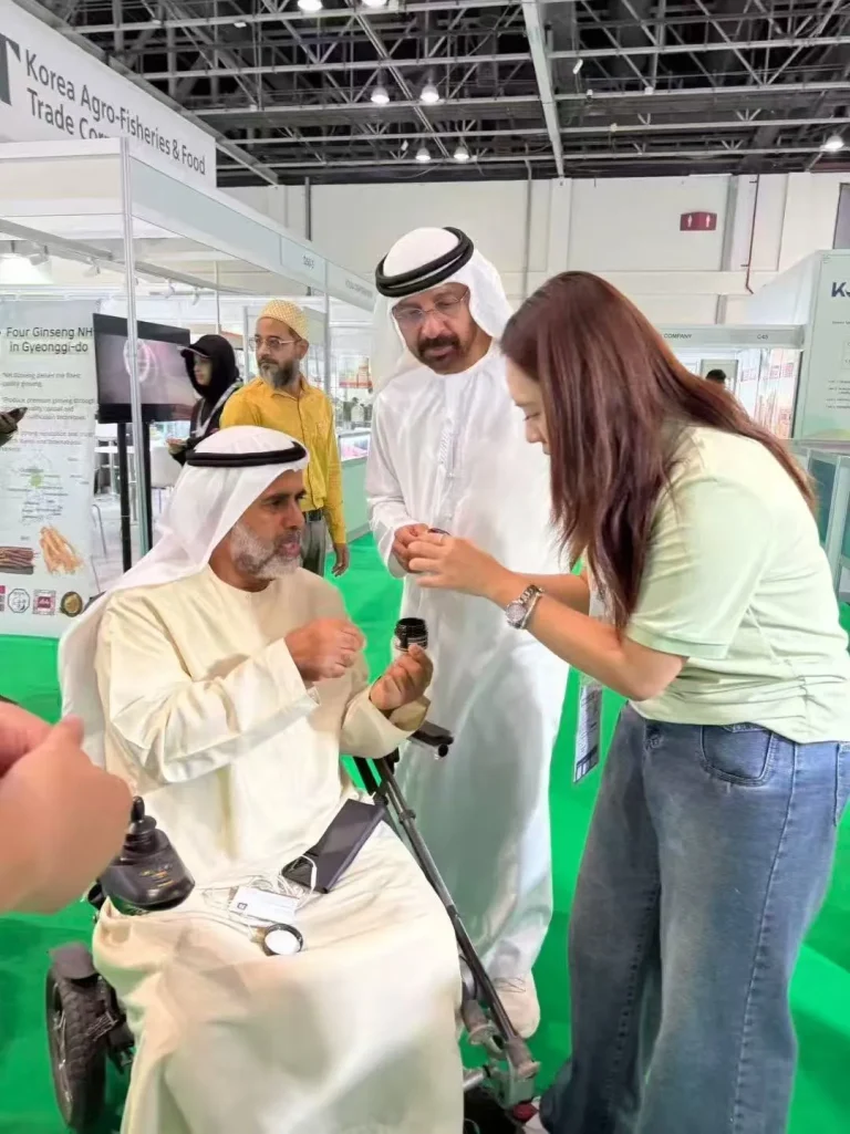 A Jiabei Health representative presenting supplement samples to visitors during the Middle East Organic Natural Expo 2025 in Dubai